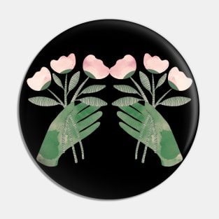 Green hands with powder pink flowers for you on black Pin