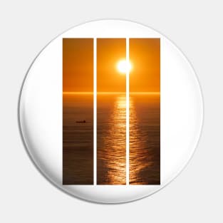 Wonderful landscapes in Norway. Nord-Norge. Beautiful scenery of a midnight sun sunset at Nordkapp (Cape North). Boat and globe on a cliff. Rippled sea and clear orange sky. (vertical) Pin