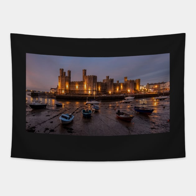 Caernarfon Castle After Sunset With Boats Tapestry by TonyNorth