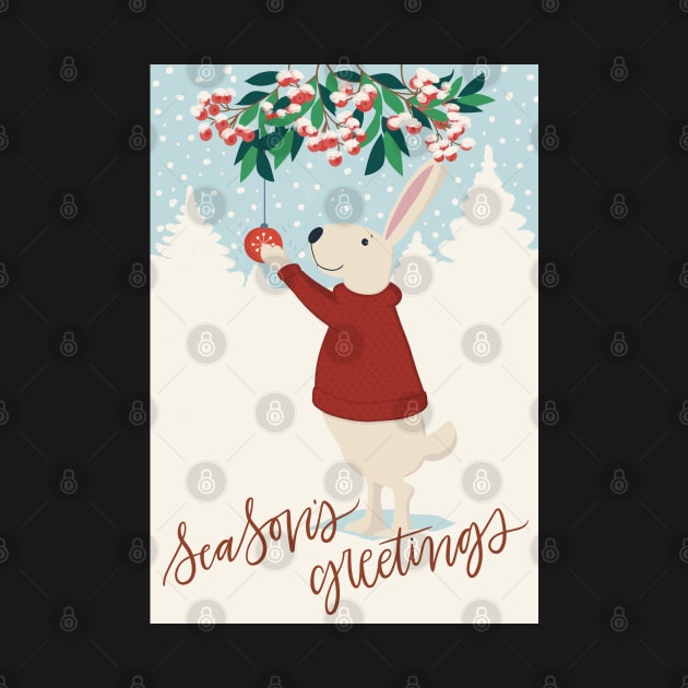 Cute rabbit in red sweater hanging up Christmas decorations in a snowy winter landscape by marina63