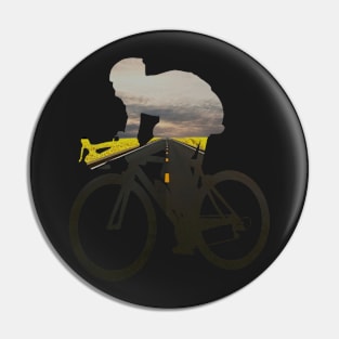 Cycling racing cyclist on the wide country road Pin