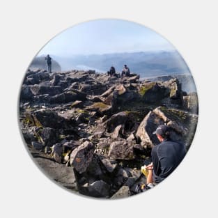 Climbers rest at the summit of Ben Nevis Pin