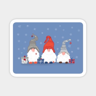 Three Christmas Gnomes with Snowflakes and Presents on Pale Blue Magnet