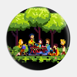 A group of people enjoying a picnic in a park Pin