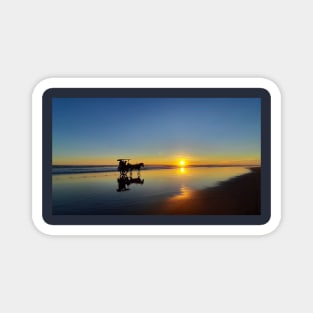 A silhouetted horse-drawn carriage on Parangtritis beach at sunset 2 Magnet