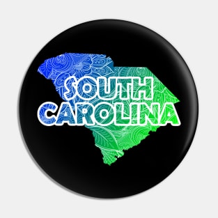 Colorful mandala art map of South Carolina with text in blue and green Pin