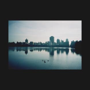 Film photo of Central Park, New York City, with its lake and surrounded buildings T-Shirt