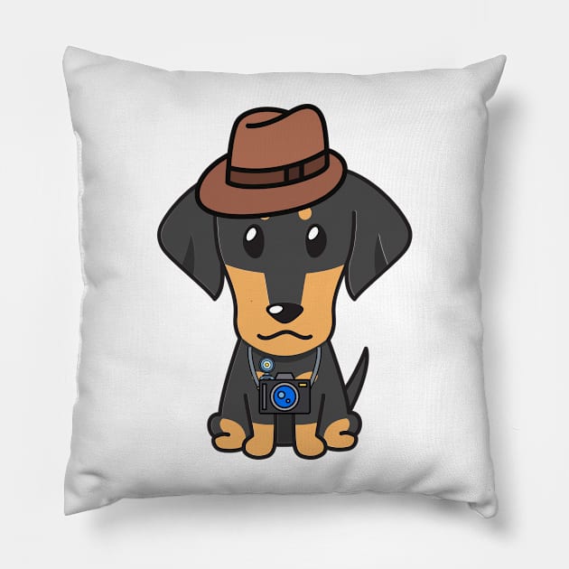 Funny dachshund is holding a camera Pillow by Pet Station