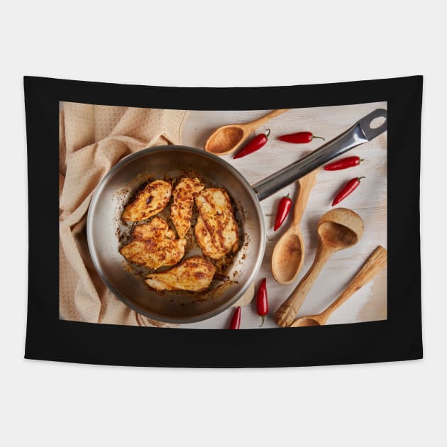 Chicken breast cooking in stainless steel pan Tapestry by naturalis