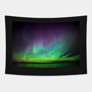 Beautiful northern lights over lake in Finland Tapestry