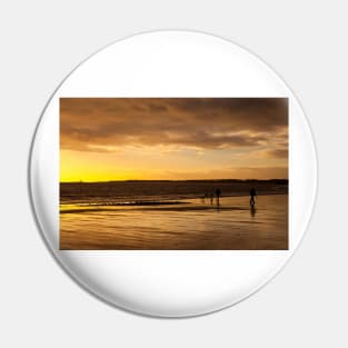 Dog walkers on the beach at sunrise Pin