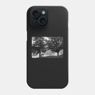 Black and white Two oak trees on river edge in early  morning fog Phone Case