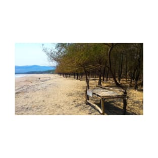 White sand beach with pine trees and selfmade bamboo bench T-Shirt