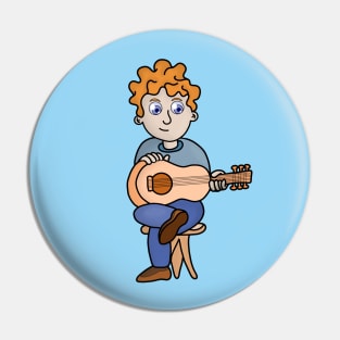 A boy with curly hair playing the guitar Pin