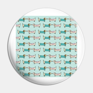 Cute dachshunds in light blue background Pin