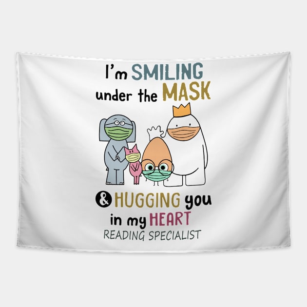 Im smiling under the mask & hugging you in my heart Reading Specialist Tapestry by janetradioactive