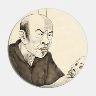 Portrait of old asian man holding human skull Pin