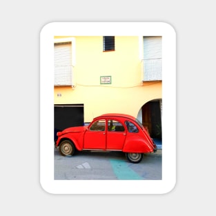 Red Citroen CV2 small red car parked outside yellow building old0fashioned,collect Magnet