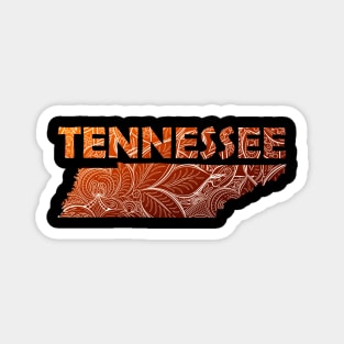 Colorful mandala art map of Tennessee with text in brown and orange Magnet