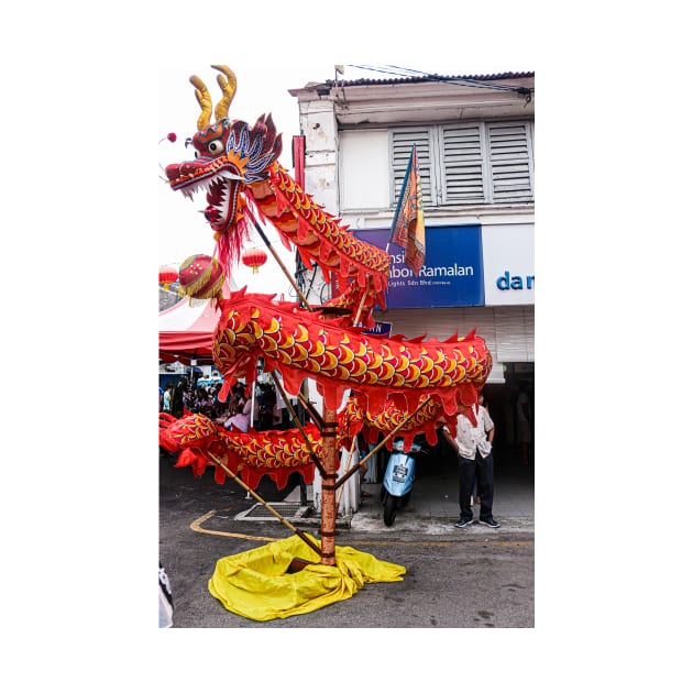A cruled long red dragon on a Chinese New Year festival on a street in Georgetown. by kall3bu
