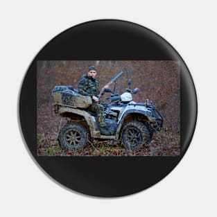 Hunter on ATV in the forest Pin