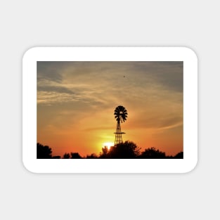 Kansas colorful Sunset with a Windmill silhouette and a bird in the sky. Magnet