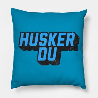 Husker Under Blue Pillow