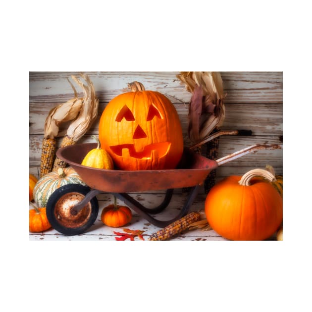 Carved Pumpkin In Old Wheelbarrow by photogarry