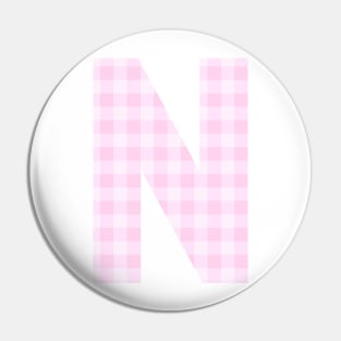 Pink Letter N in Plaid Pattern Background. Pin