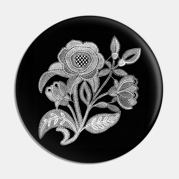 embroidery image with fabric and threads forming a stylized black and white flower branch Pin by Marccelus