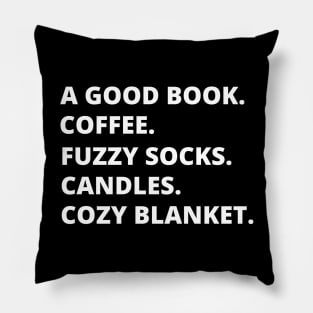 A GOOD BOOK. COFFEE. FUZZY SOCKS. CANDLES. COZY BLANKET. Pillow