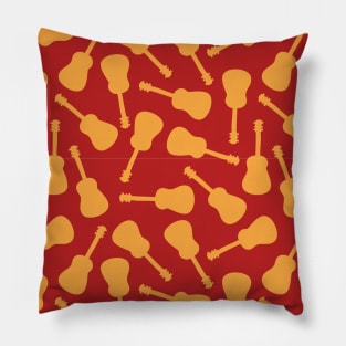 Guitar silhouettes orange yellow on a red background. Ukulele pattern. Pillow