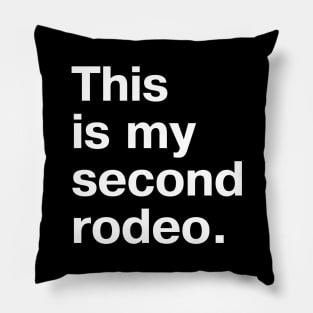 "This is my second rodeo." in plain white letters - cos you're not the noob, but barely Pillow