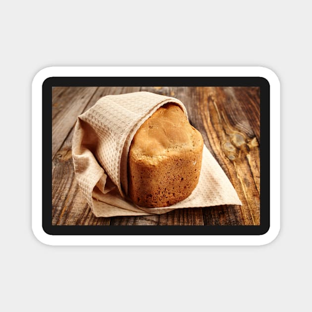 Homemade bread on a wooden board Magnet by naturalis