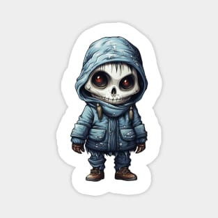 The figure of a ghoulish skull girl in a mask, wearing a cloak, perfect for Halloween, covered with snow ! Magnet