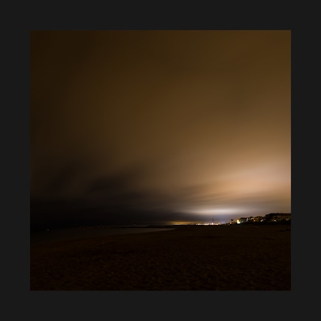 Beach of Carnon with an Illuminated Cloud Cover at Night by holgermader