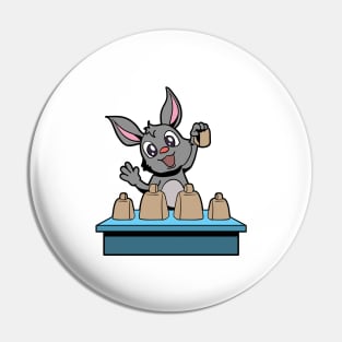 Cartoon bunny playing cowbells Pin