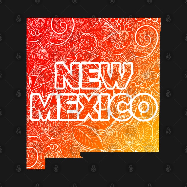 Colorful mandala art map of New Mexico with text in red and orange by Happy Citizen