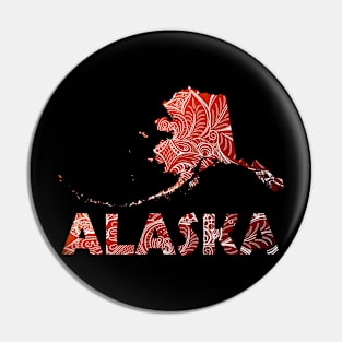 Colorful mandala art map of Alaska with text in brown and orange Pin