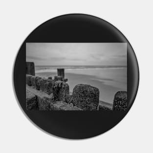 Close up of wooden sea defences protecting against coastal erosion Pin