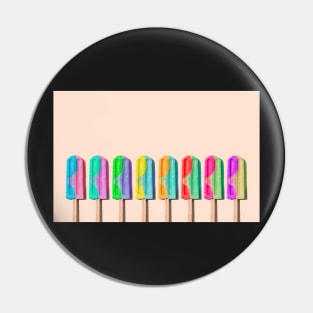 Row of rainbow-colored icecream lollies Pin