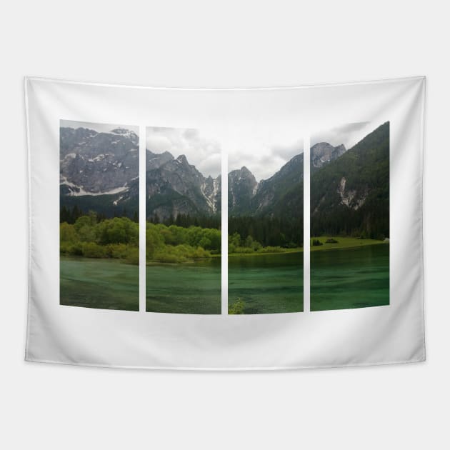 A static shot from the shore of Fusine lake in the Julian Alps with snowy mountains in background. Beautiful nature in a spring cloudy day; no people around Tapestry by fabbroni-art