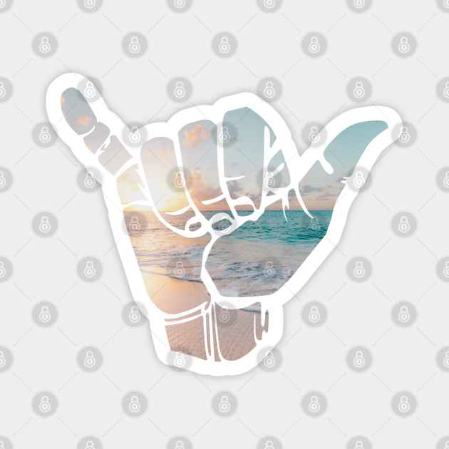 Shaka hang loose hand gesture with photograph of beach sunset Shaka