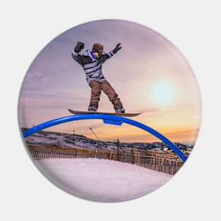 Snowboarder sliding on a rail Pin