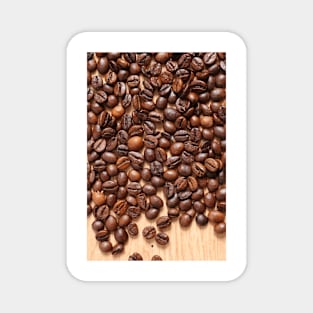 Coffee beans on wood table Magnet