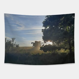 Combine harvester at sunset Cap Tapestry