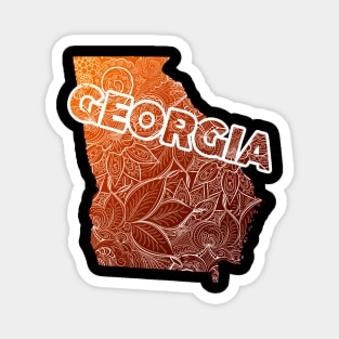 Colorful mandala art map of Georgia with text in brown and orange Magnet