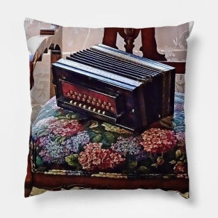 Button Accordion on Chair With Flowered Seat Pillow