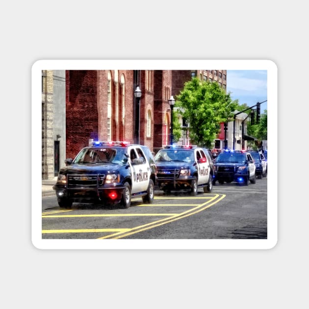 Line of Police Cars Magnet by SusanSavad