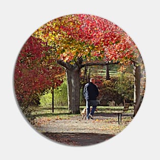 Man Walking Dog in Autumn Park Pin